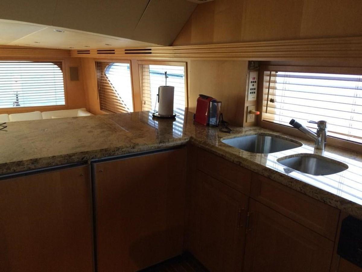 a kitchen with a sink and a window aboard IN FLIGHT Yacht for Sale
