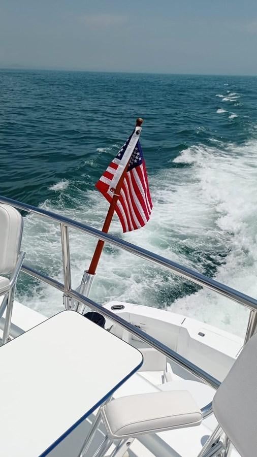 a flag on a boat aboard IN FLIGHT Yacht for Sale