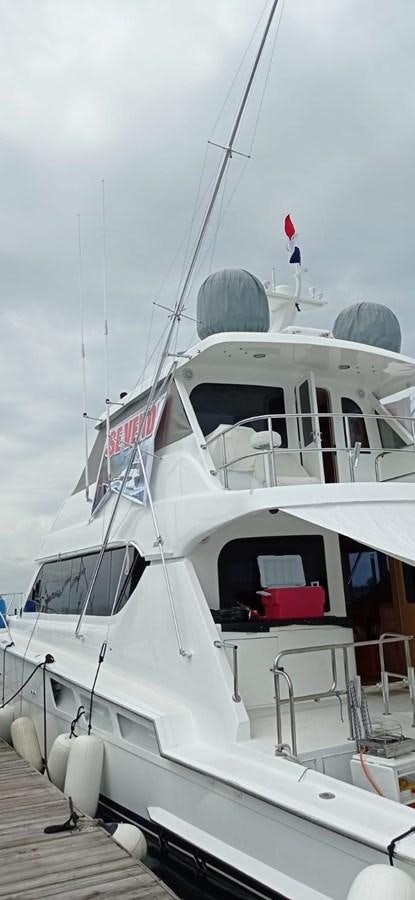 a white boat on a dock aboard IN FLIGHT Yacht for Sale