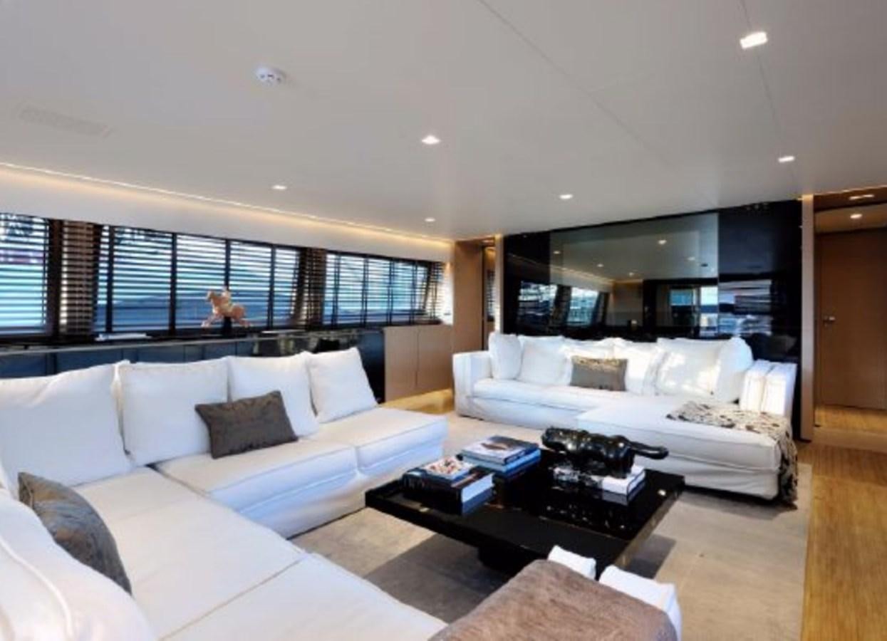 a living room with a large window aboard BERTONA III Yacht for Sale