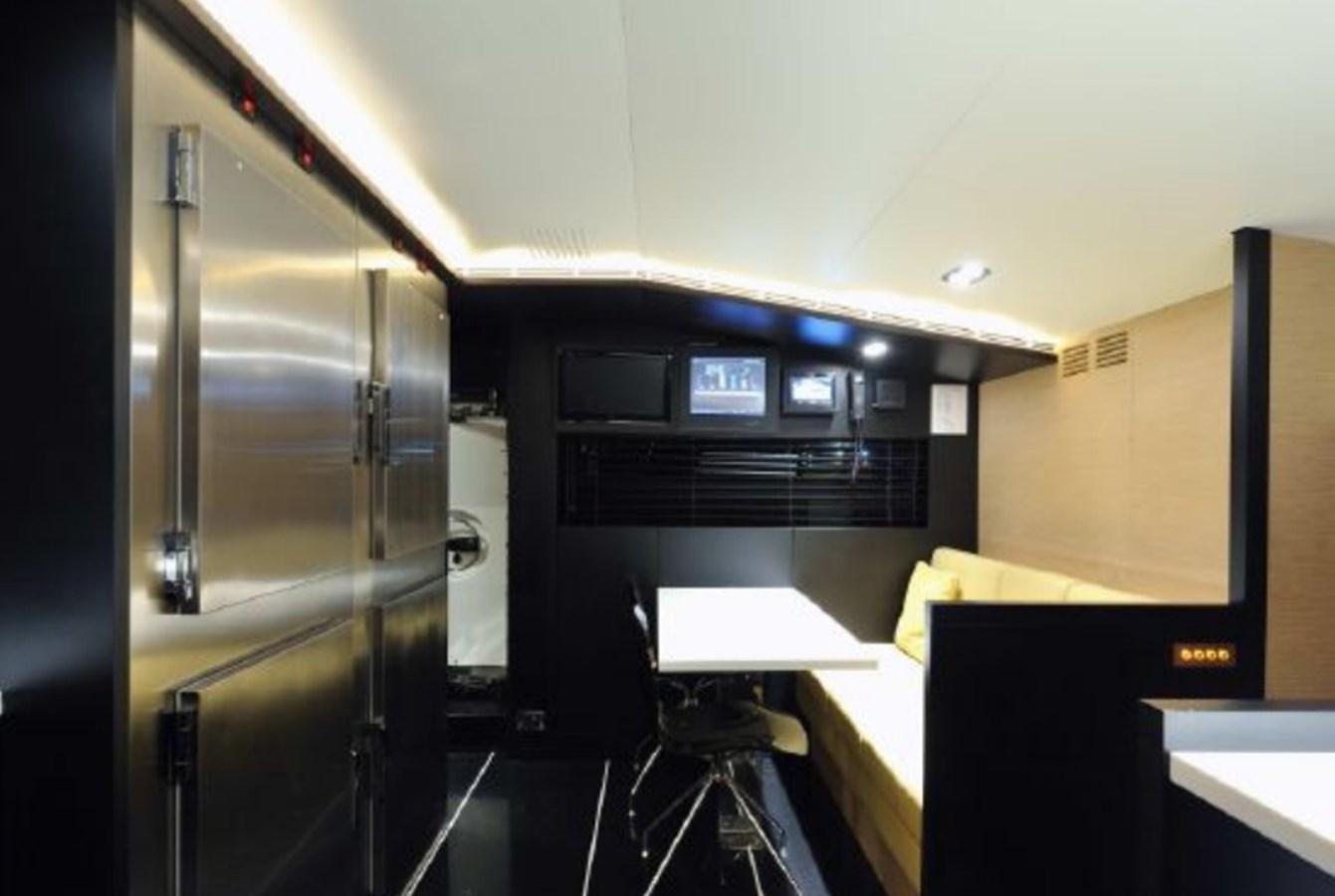 a large machine in a room aboard BERTONA III Yacht for Sale