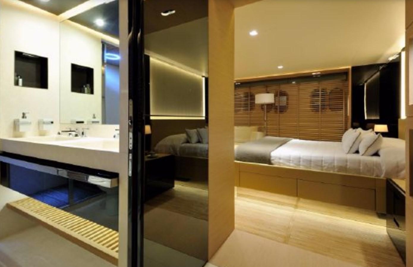 a room with a bed and a couch aboard BERTONA III Yacht for Sale