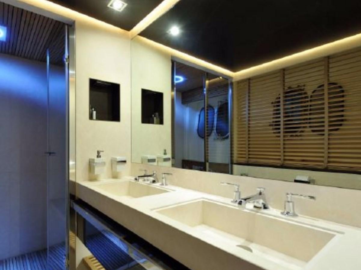 a bathroom with sinks and mirrors aboard BERTONA III Yacht for Sale