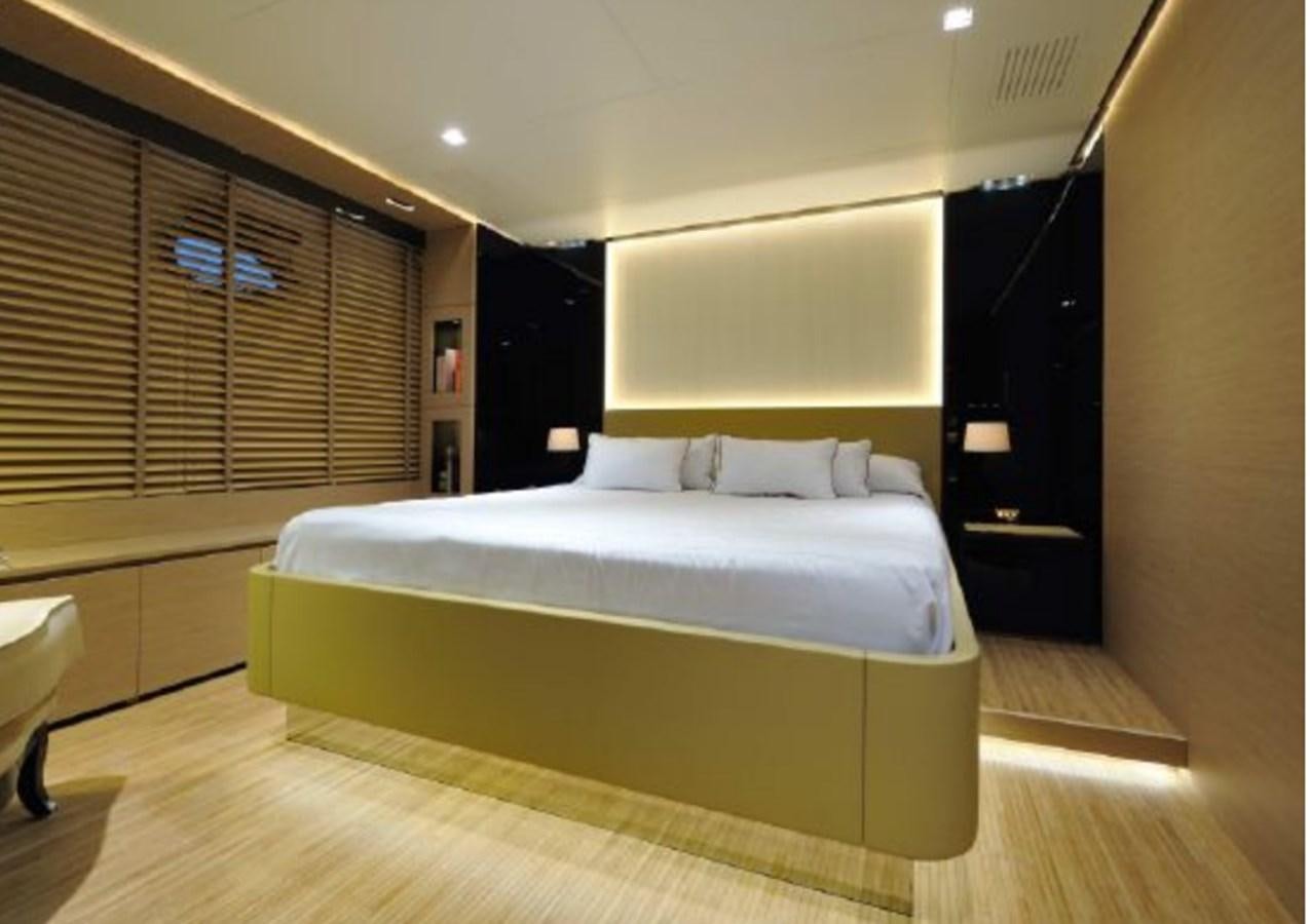a bed in a room aboard BERTONA III Yacht for Sale