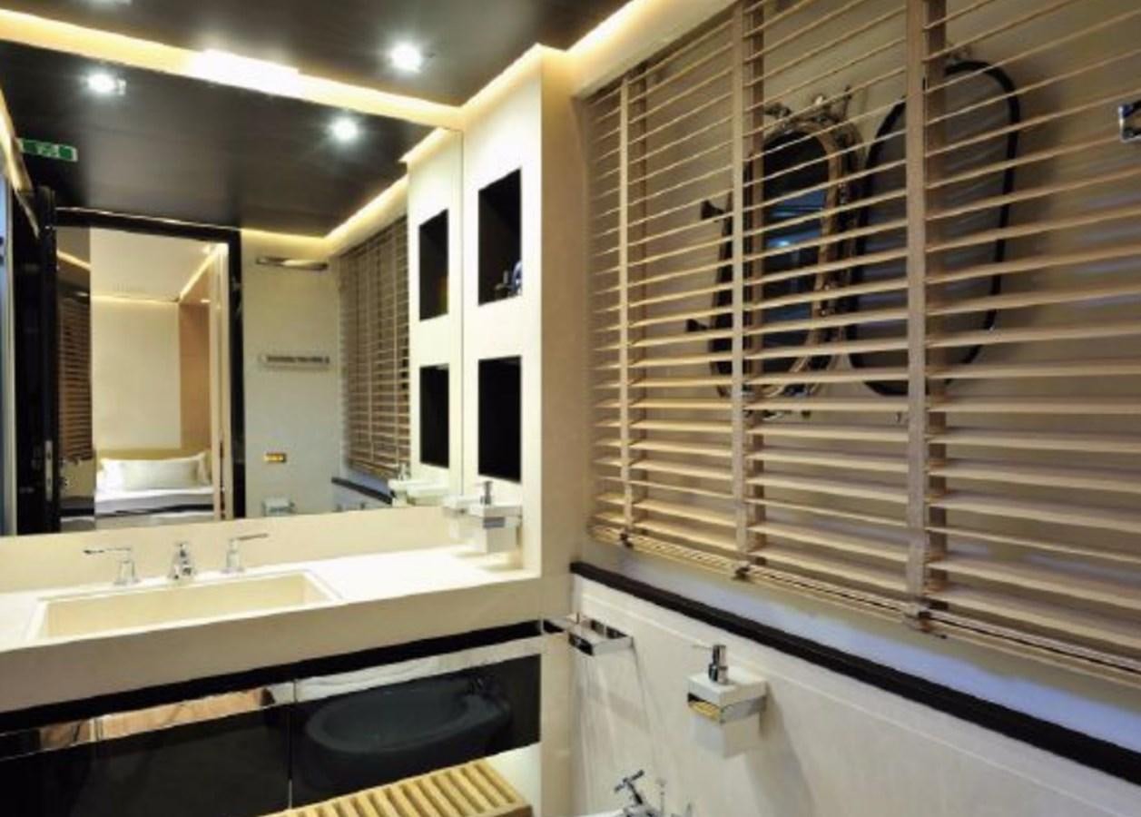 a bathroom with a large mirror aboard BERTONA III Yacht for Sale