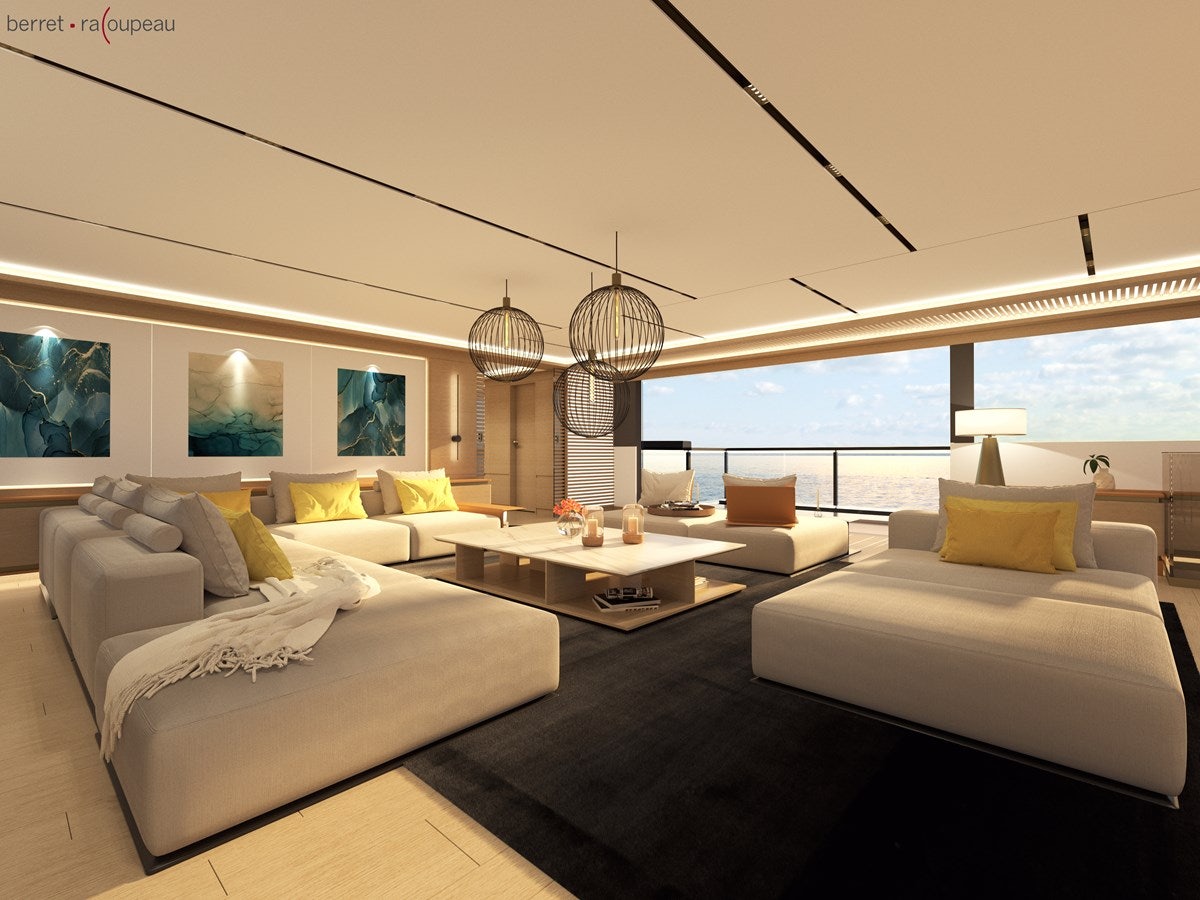 a room with a couch and a table aboard ZEFFIRO 130' Yacht for Sale