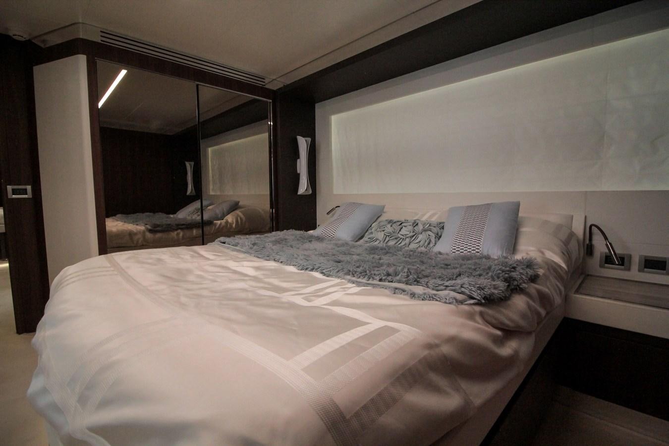 a bed with white sheets aboard SEDA Yacht for Sale