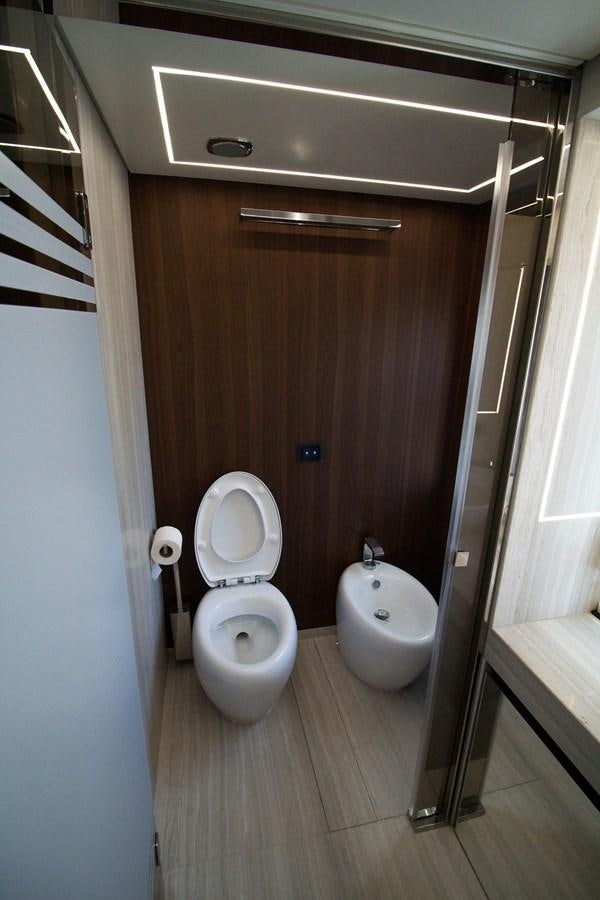 a bathroom with a toilet and a bidet aboard SEDA Yacht for Sale