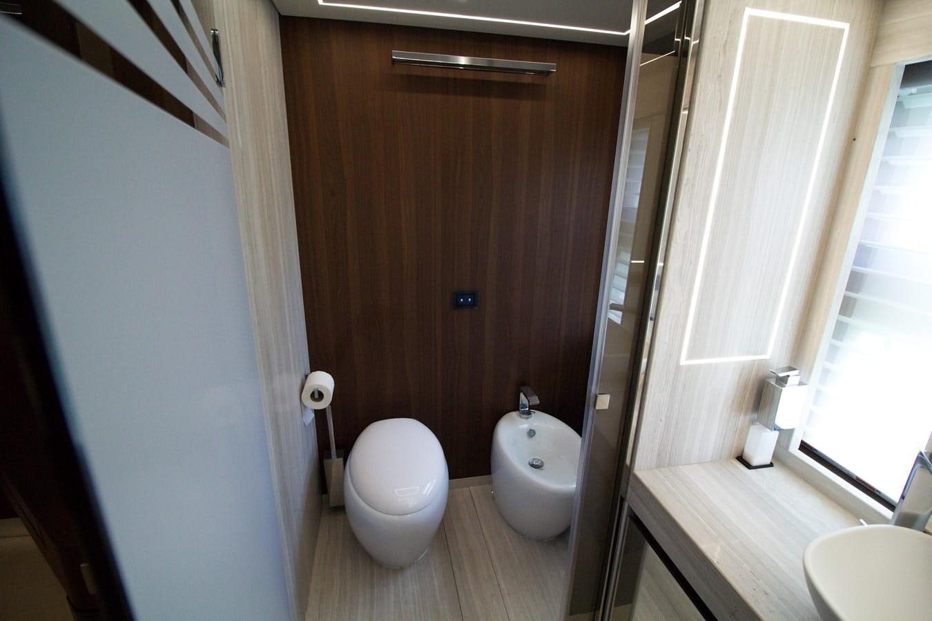 a bathroom with a toilet and a sink aboard SEDA Yacht for Sale