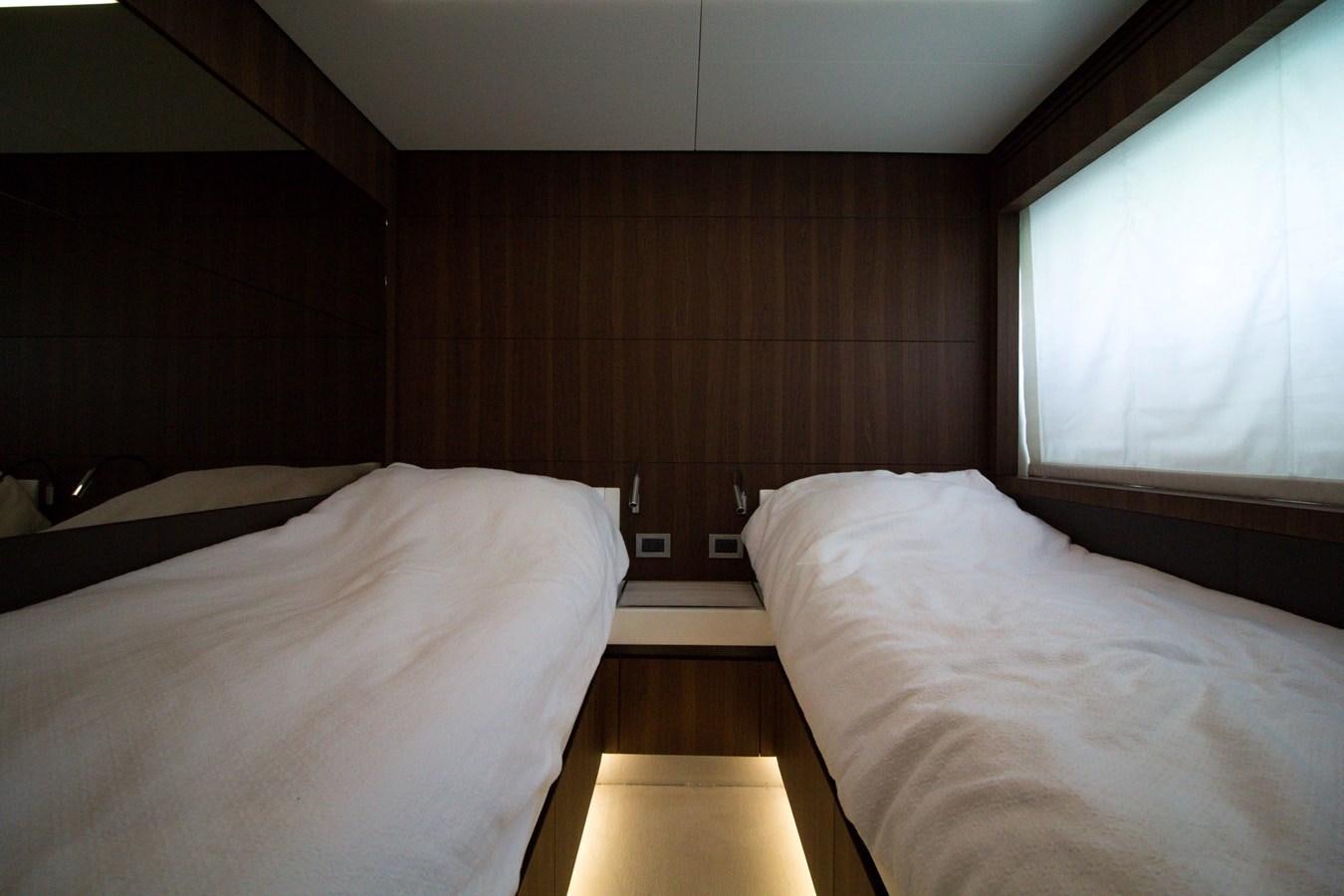 a room with two beds aboard SEDA Yacht for Sale