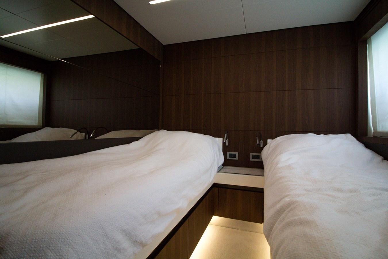 a room with two beds aboard SEDA Yacht for Sale