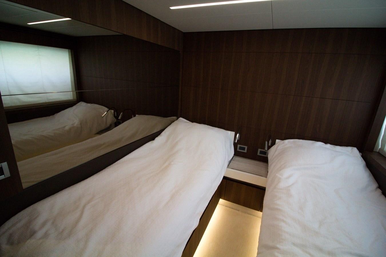 a couple of beds in a room aboard SEDA Yacht for Sale