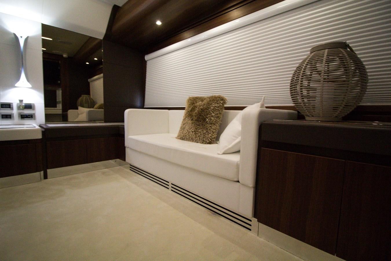 a room with a couch and a fan aboard SEDA Yacht for Sale