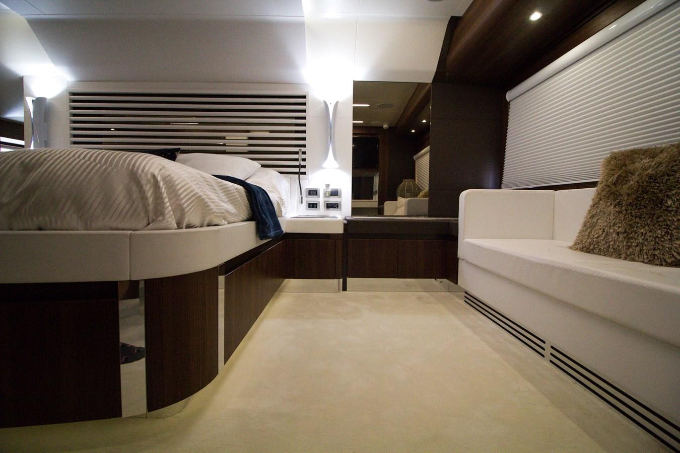 a room with a bed and a couch aboard SEDA Yacht for Sale