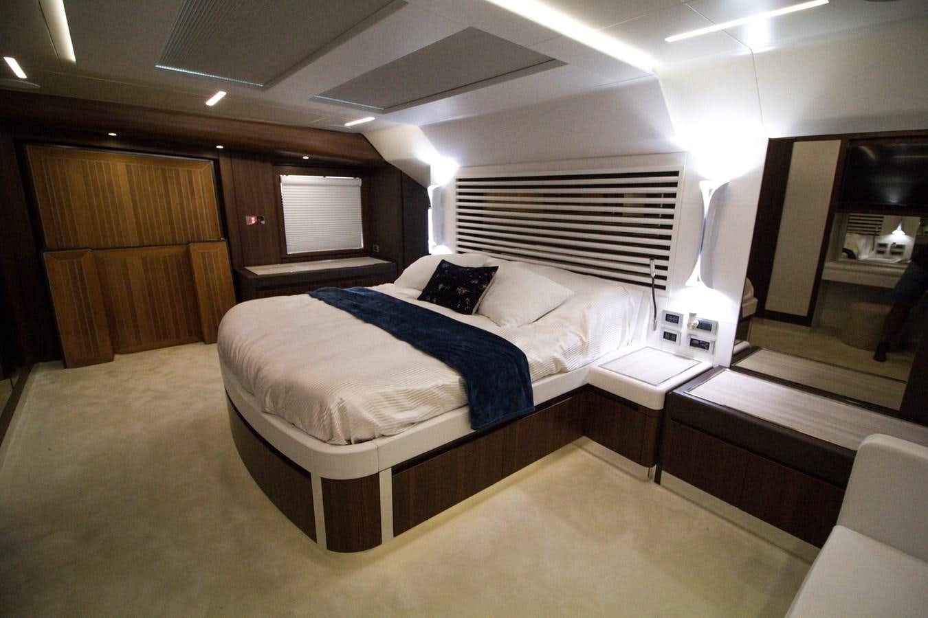 a room with a bed and a desk aboard SEDA Yacht for Sale