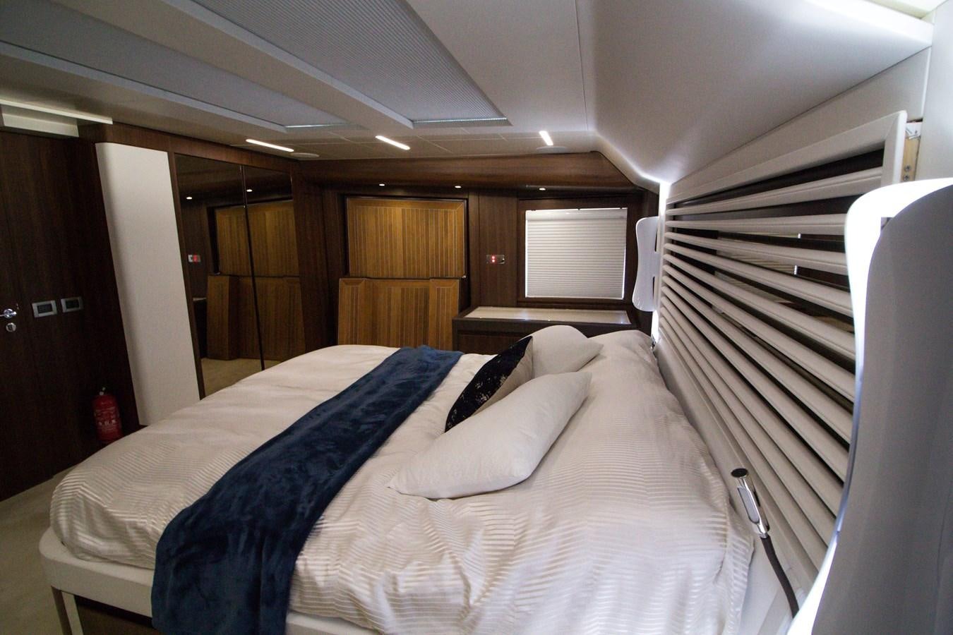 a bed with white sheets aboard SEDA Yacht for Sale