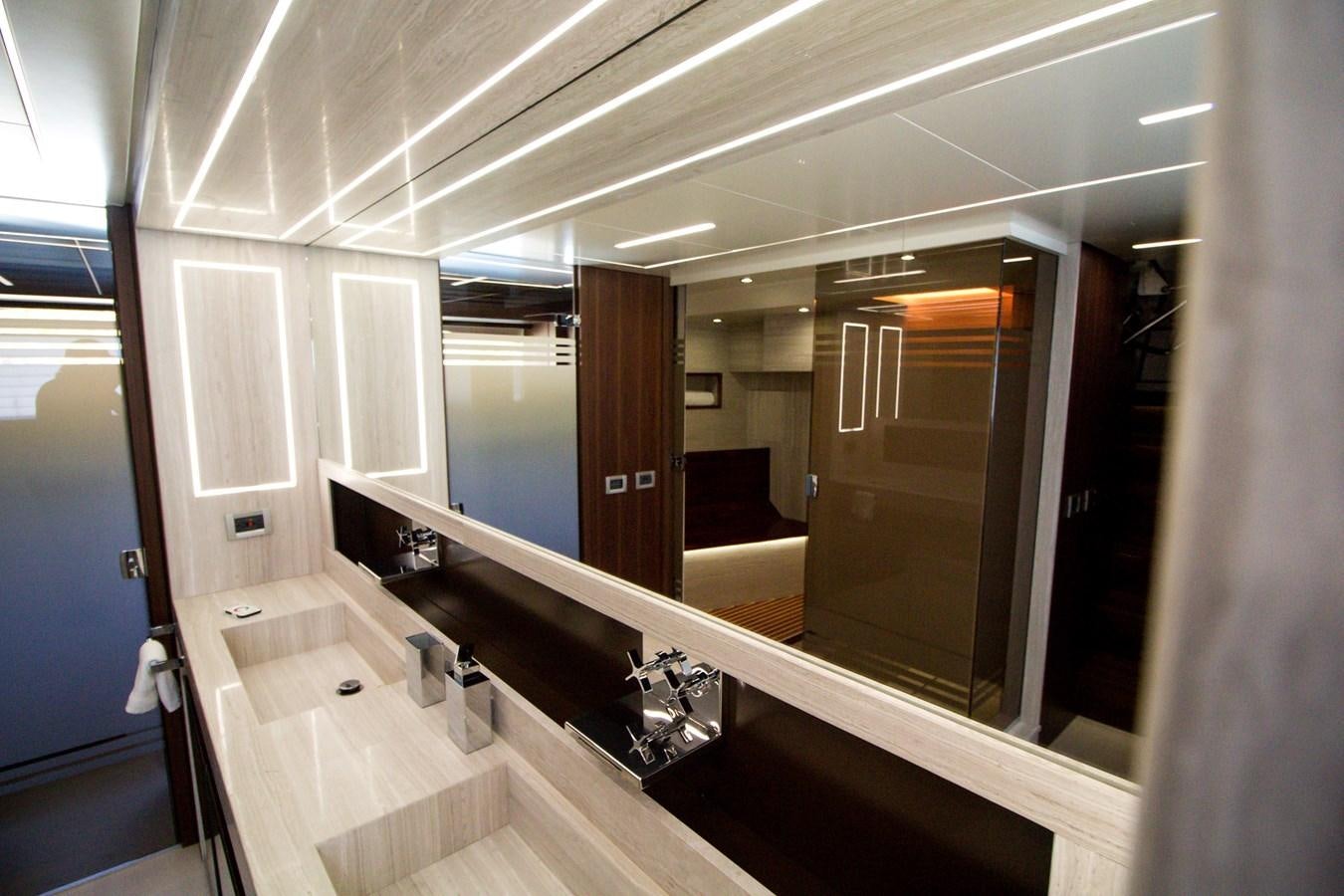 a bathroom with a large mirror aboard SEDA Yacht for Sale