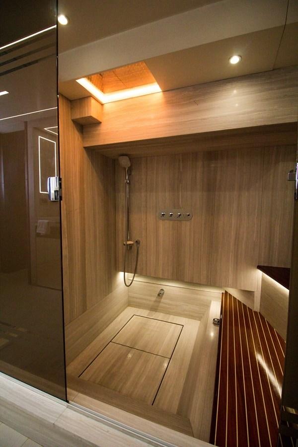 a bathroom with wooden walls aboard SEDA Yacht for Sale
