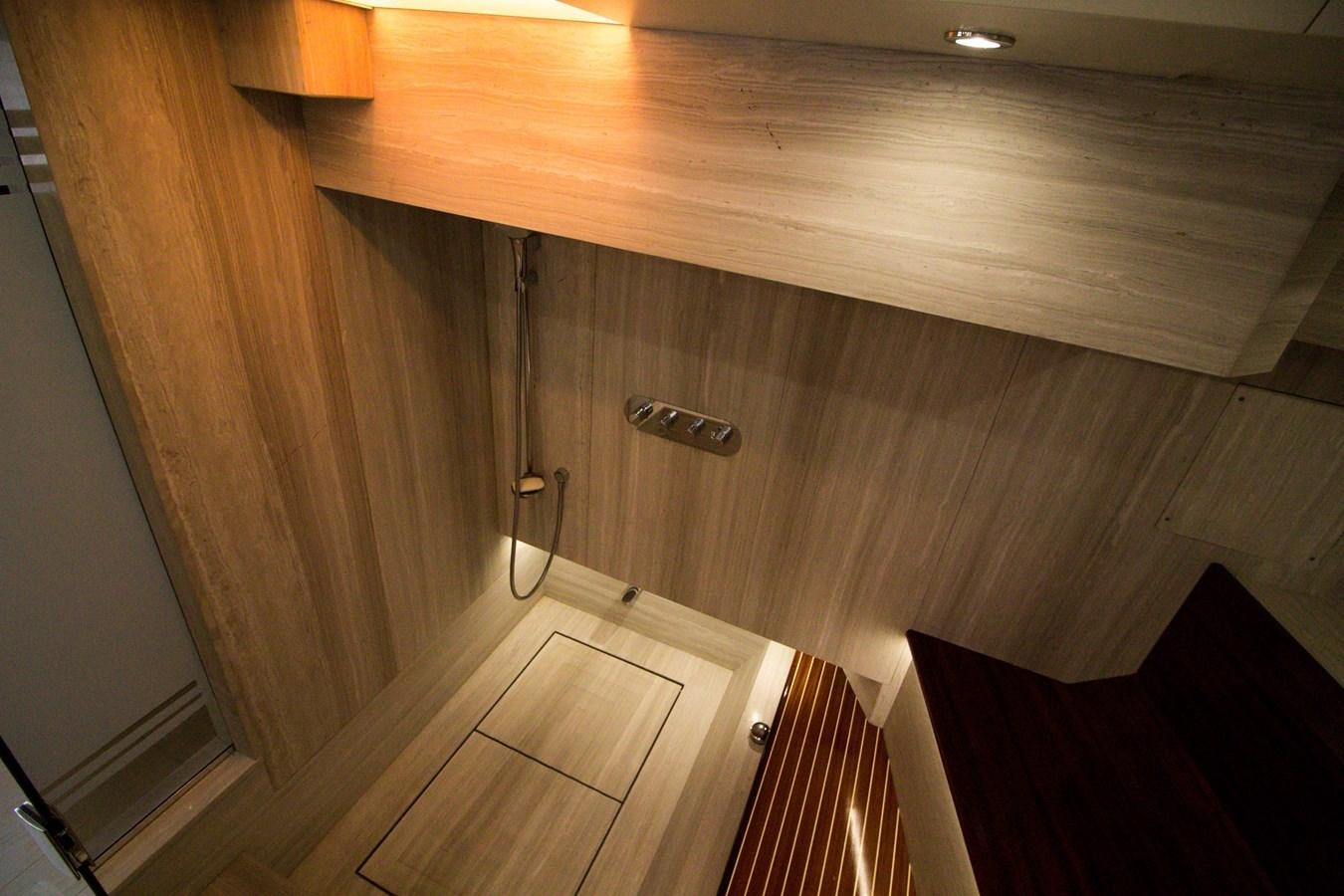 a wooden shelf with a door aboard SEDA Yacht for Sale