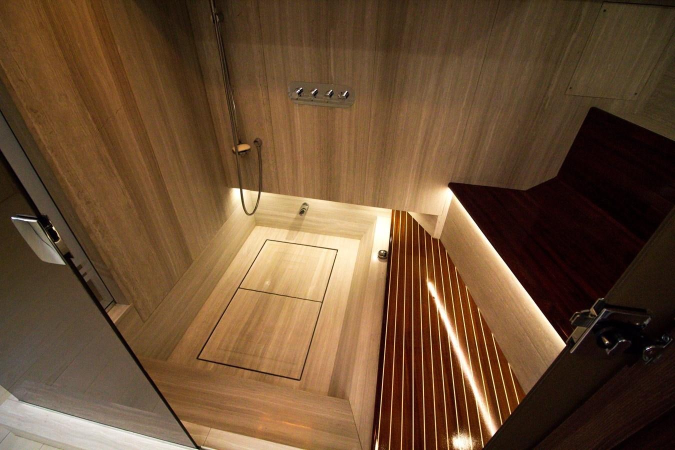 a wooden staircase with a door aboard SEDA Yacht for Sale
