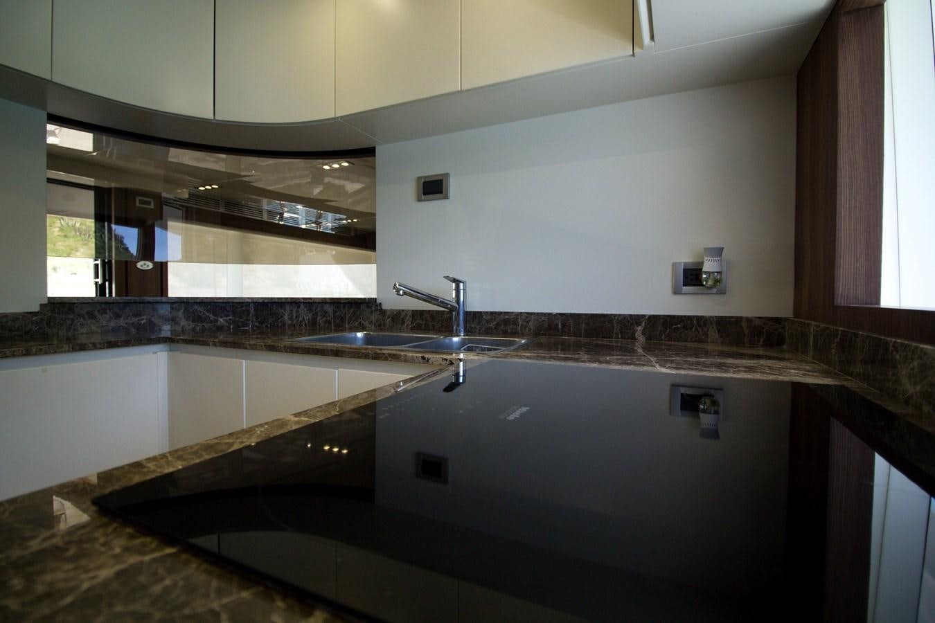 a kitchen with a sink and cabinets aboard SEDA Yacht for Sale