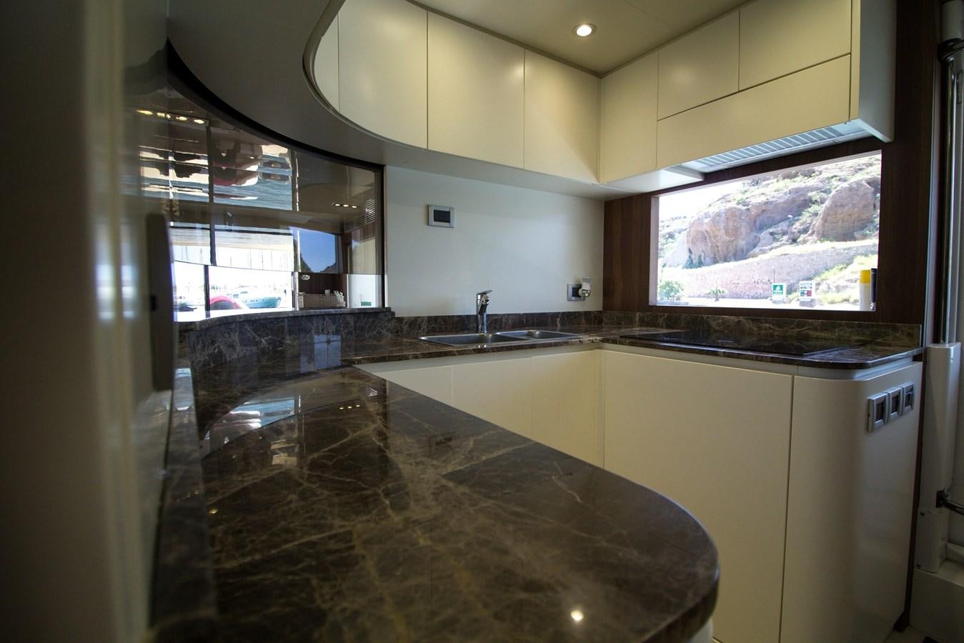 a kitchen with a large marble counter top aboard SEDA Yacht for Sale
