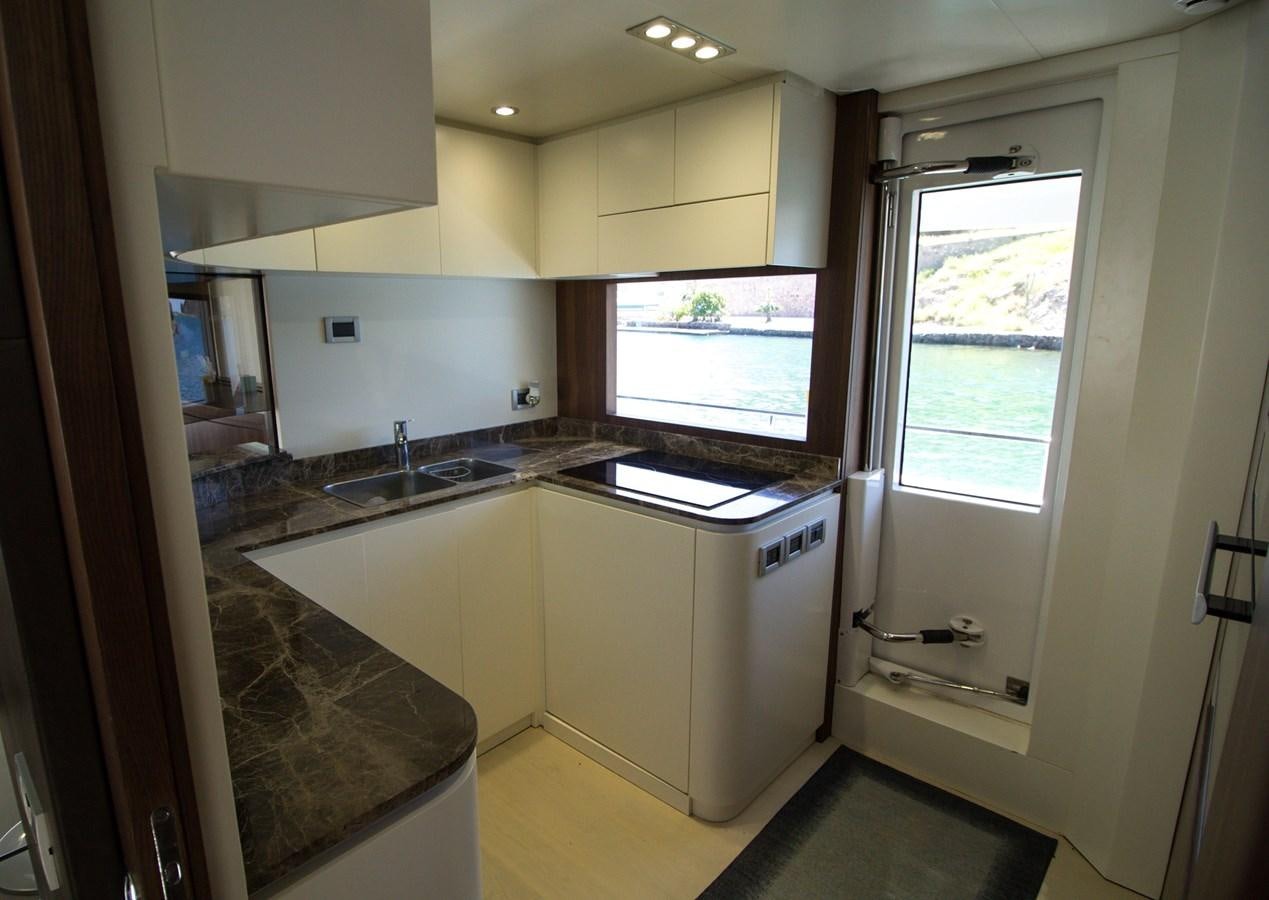 a kitchen with a sink and a window aboard SEDA Yacht for Sale
