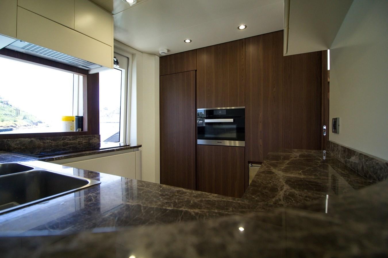 a kitchen with granite counter tops aboard SEDA Yacht for Sale