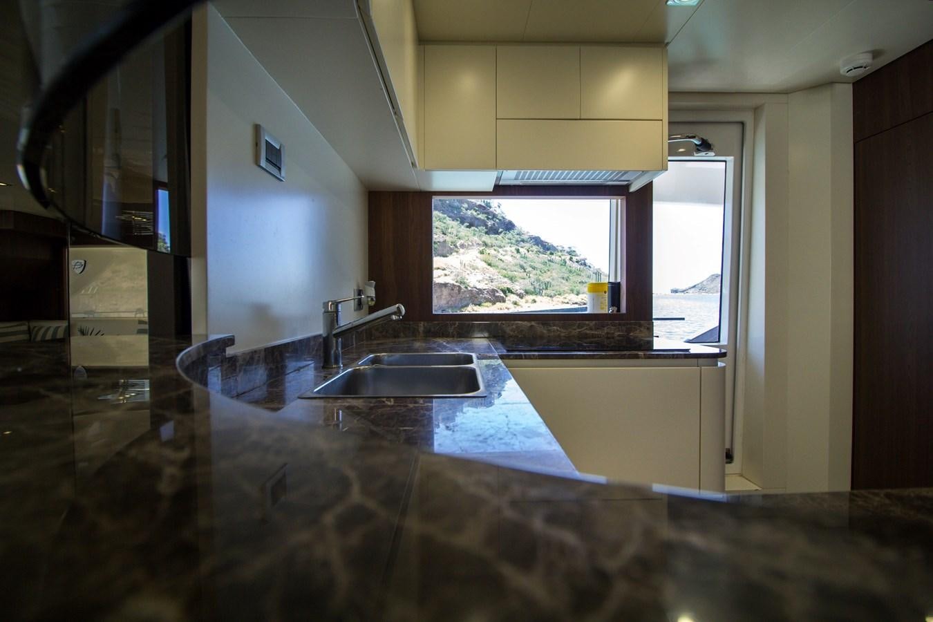 a kitchen with a large marble counter top aboard SEDA Yacht for Sale