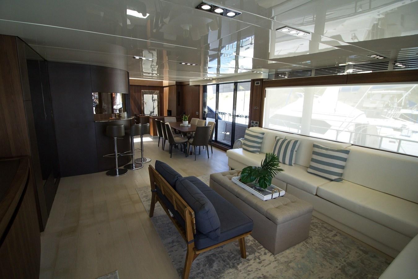 a living room with a couch and a table aboard SEDA Yacht for Sale