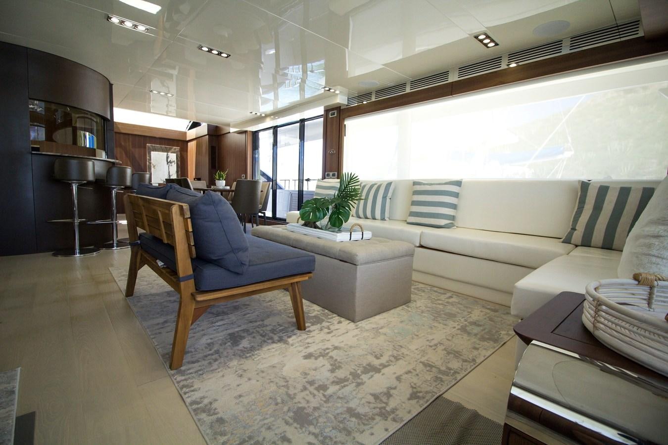 a living room with a couch and a table aboard SEDA Yacht for Sale