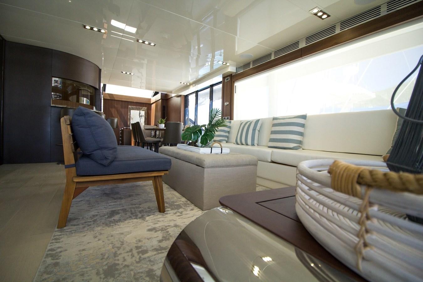 a living room with a couch and a table aboard SEDA Yacht for Sale
