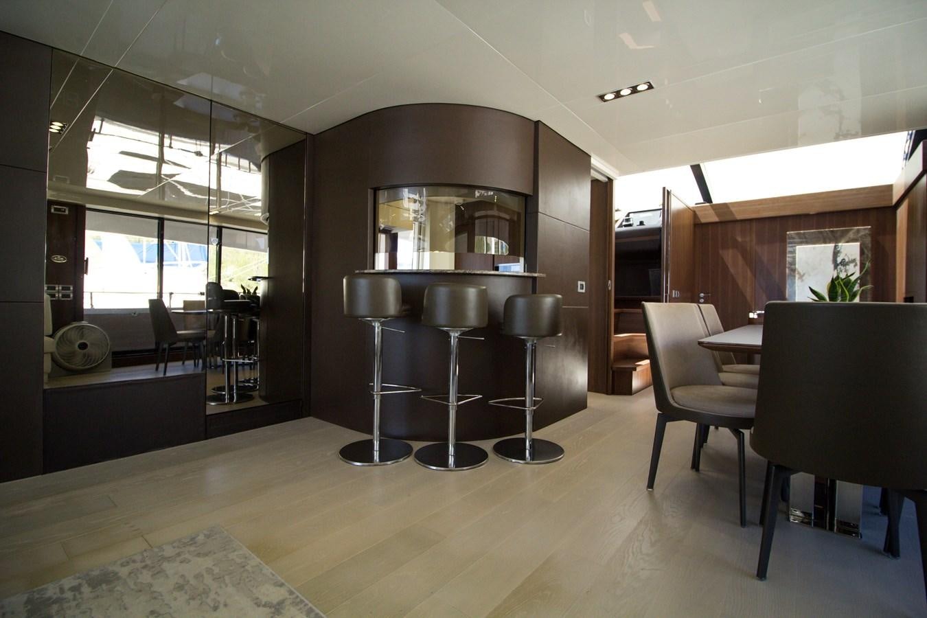 a kitchen with a fireplace aboard SEDA Yacht for Sale