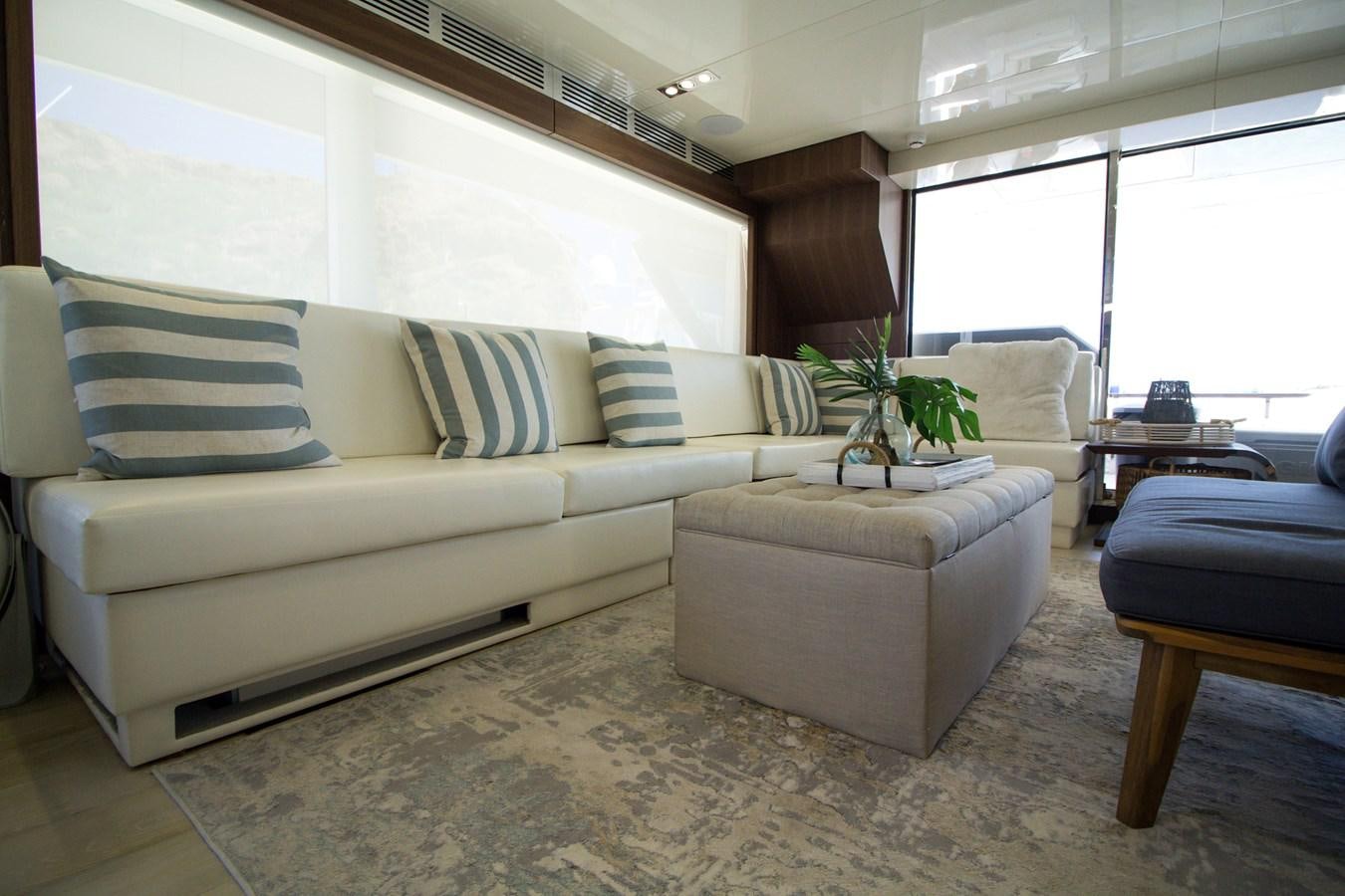 a living room with a couch and a table aboard SEDA Yacht for Sale