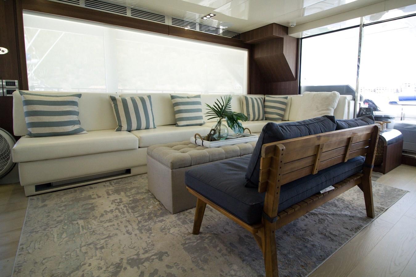 a living room with a couch and a table aboard SEDA Yacht for Sale