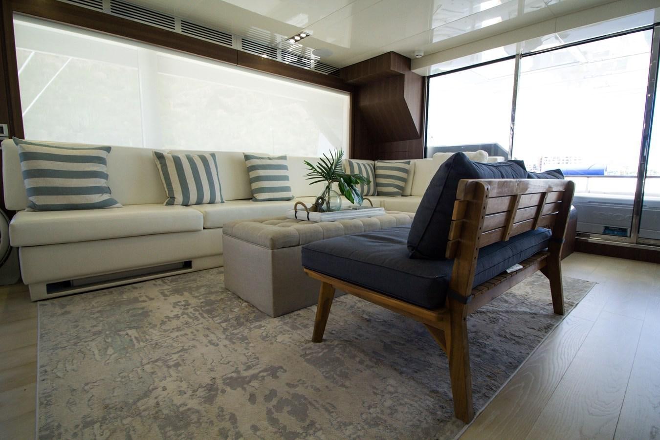 a living room with a couch and a table aboard SEDA Yacht for Sale