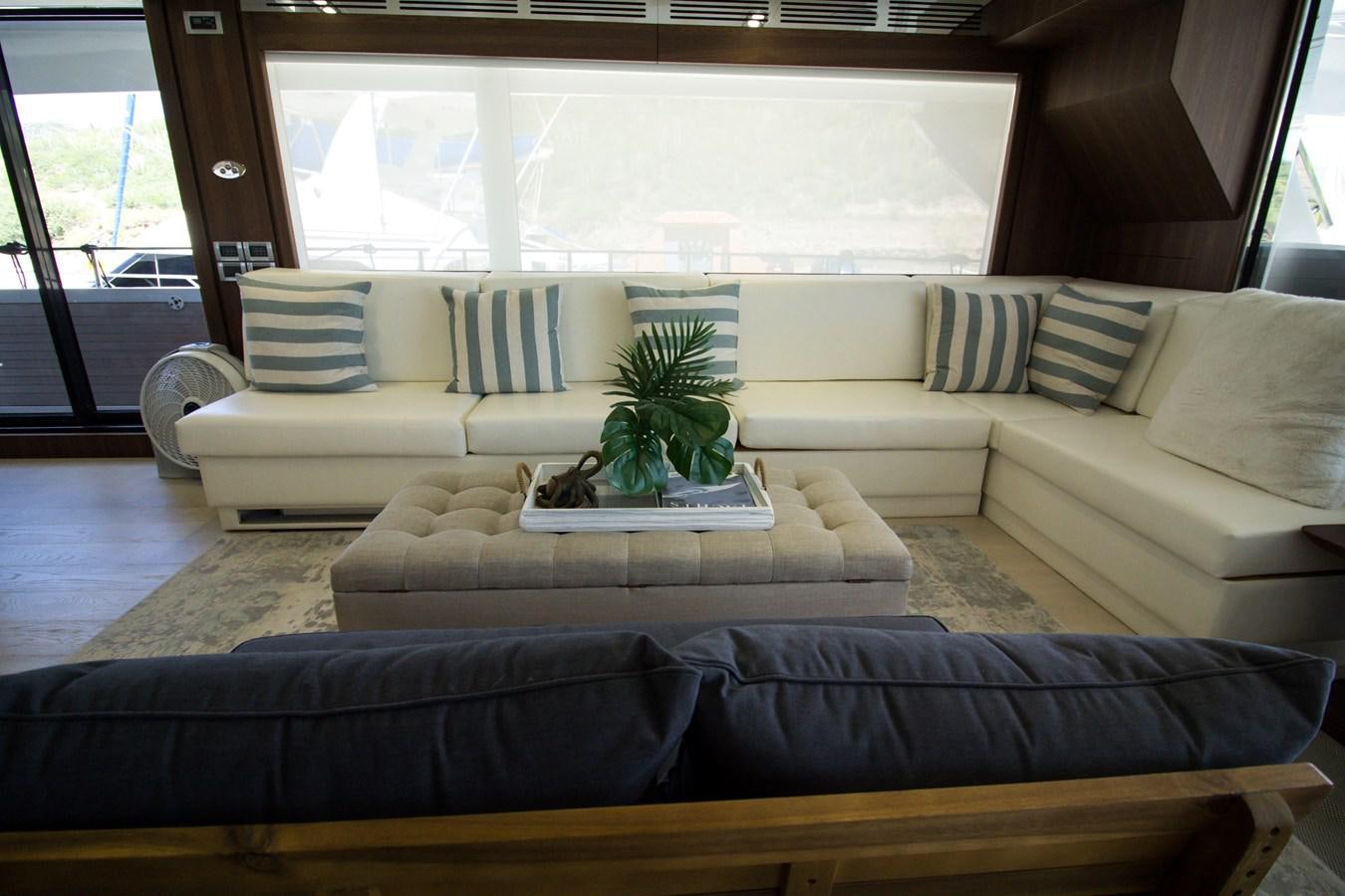 a living room with a couch and a coffee table aboard SEDA Yacht for Sale