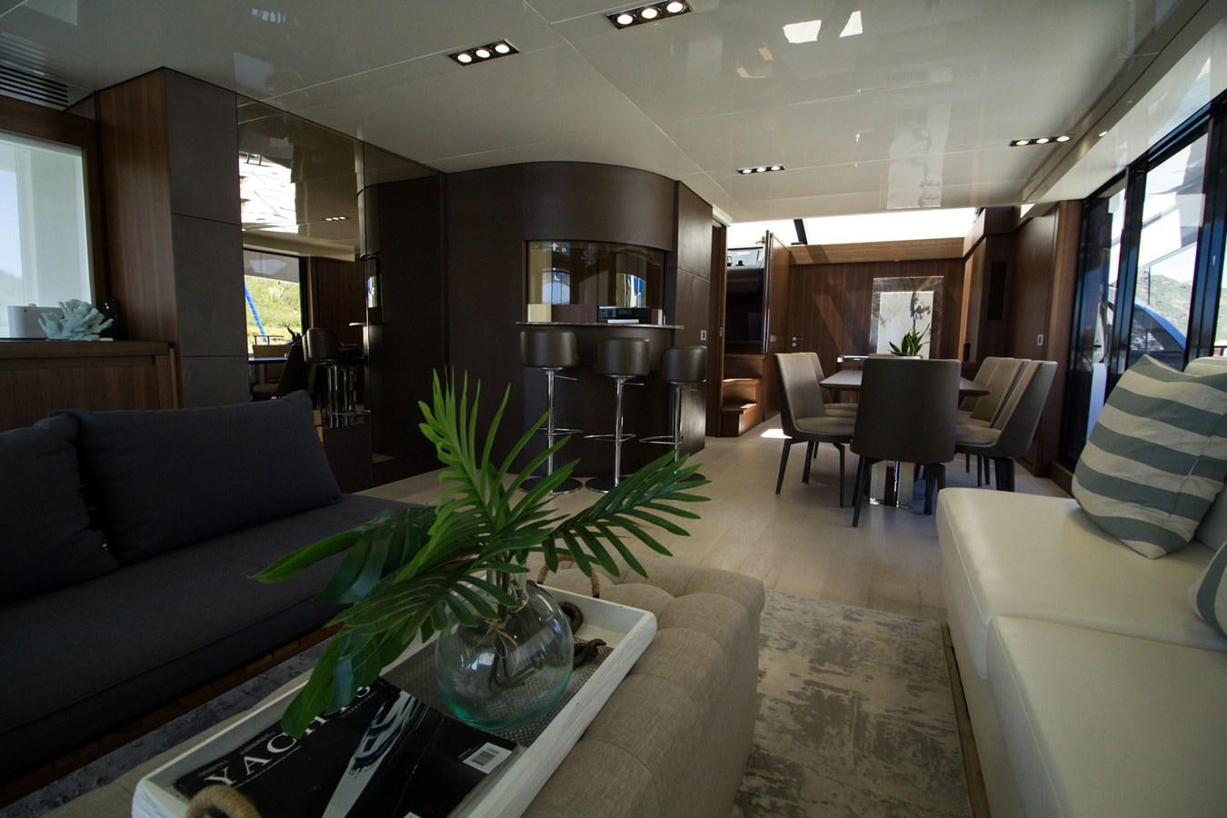 a living room with a couch and a coffee table aboard SEDA Yacht for Sale