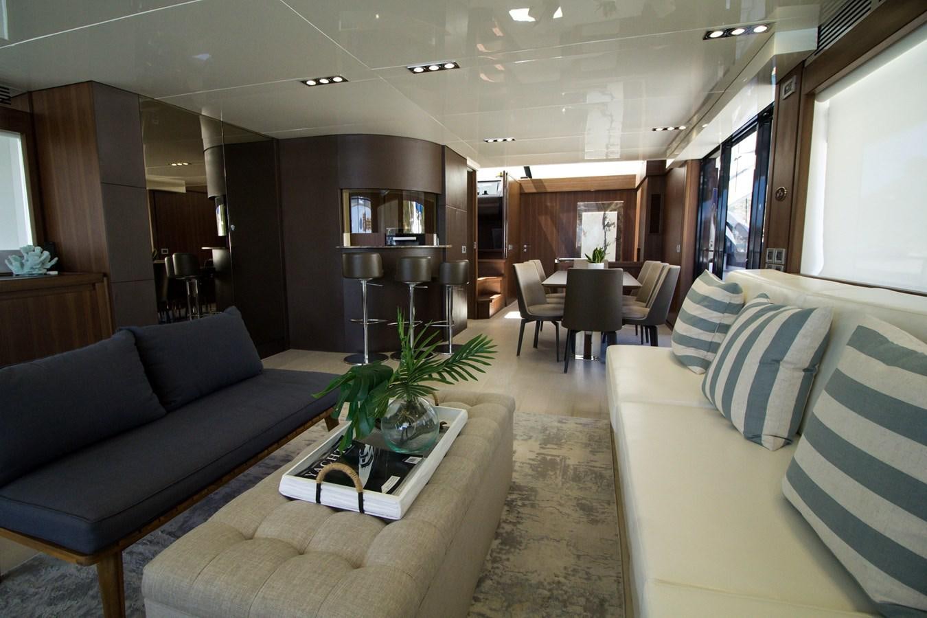a living room with a couch and a table aboard SEDA Yacht for Sale