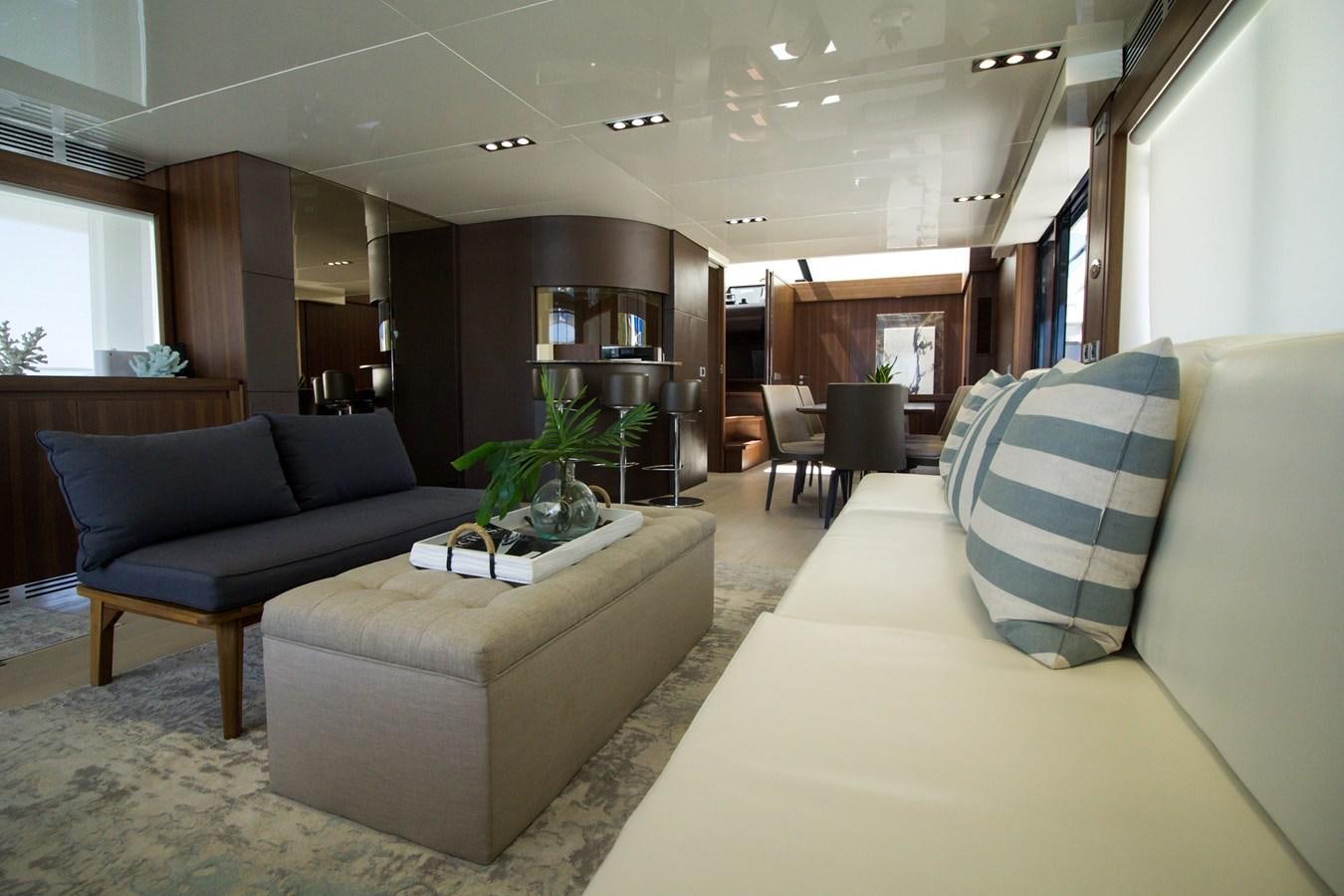 a living room with a couch and a coffee table aboard SEDA Yacht for Sale