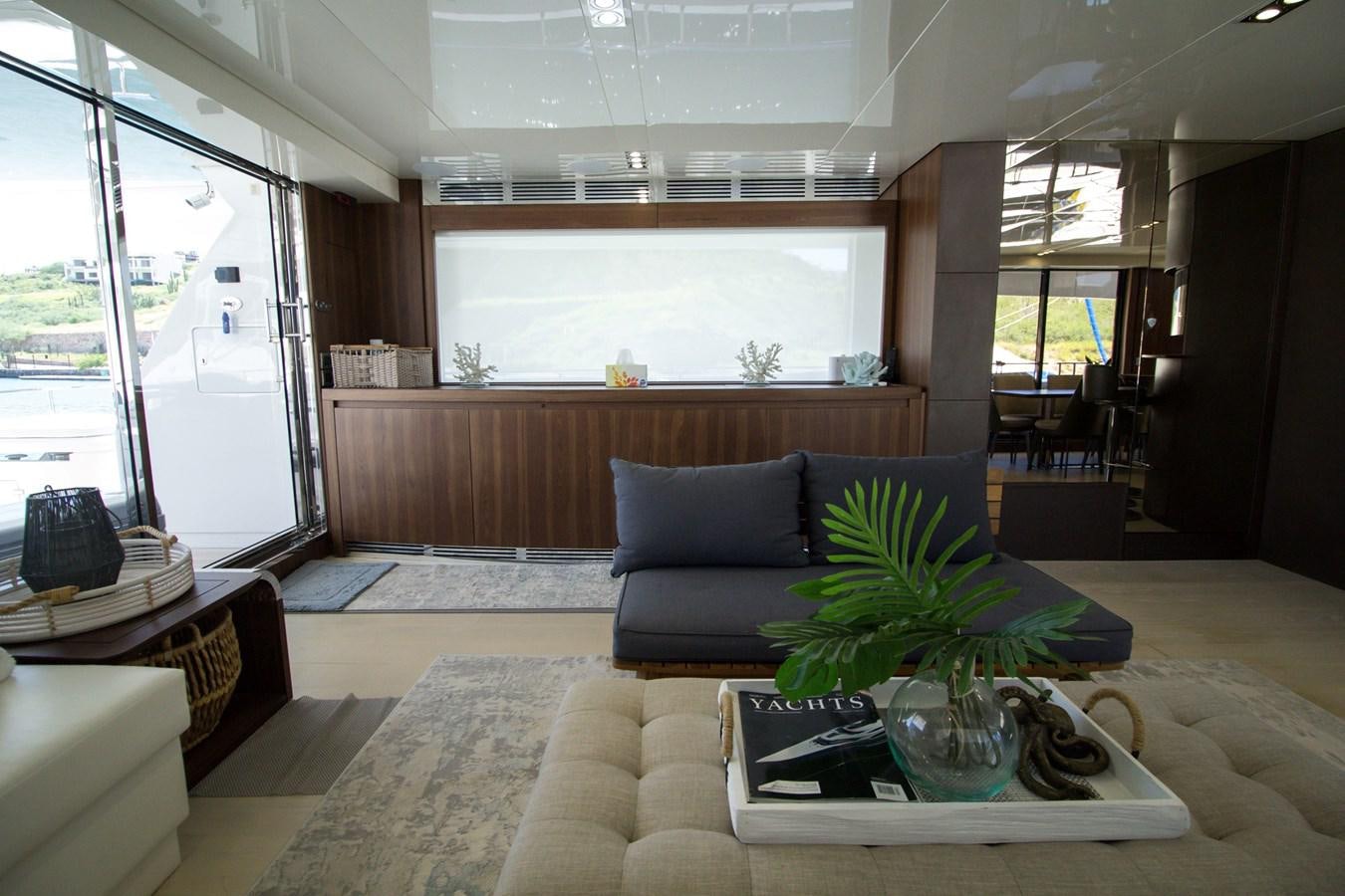 a living room with a couch and a coffee table aboard SEDA Yacht for Sale