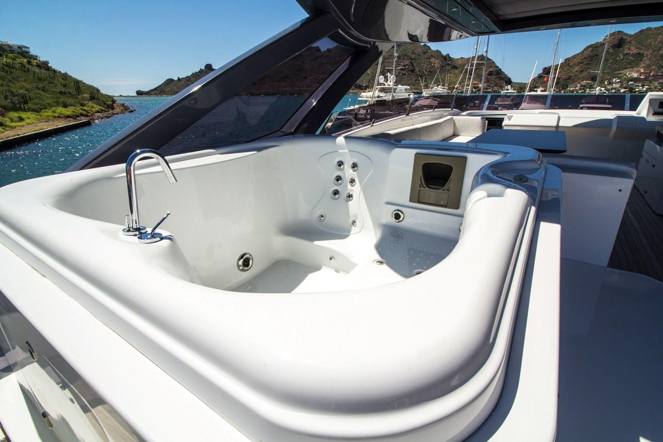 a white boat on a body of water aboard SEDA Yacht for Sale