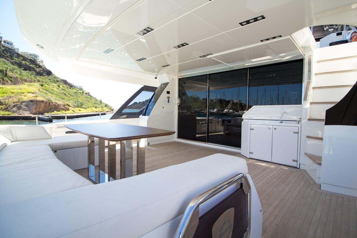 a room with a table and chairs aboard SEDA Yacht for Sale