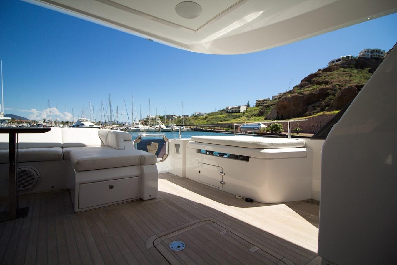 a room with a pool and a deck with a view of the water aboard SEDA Yacht for Sale