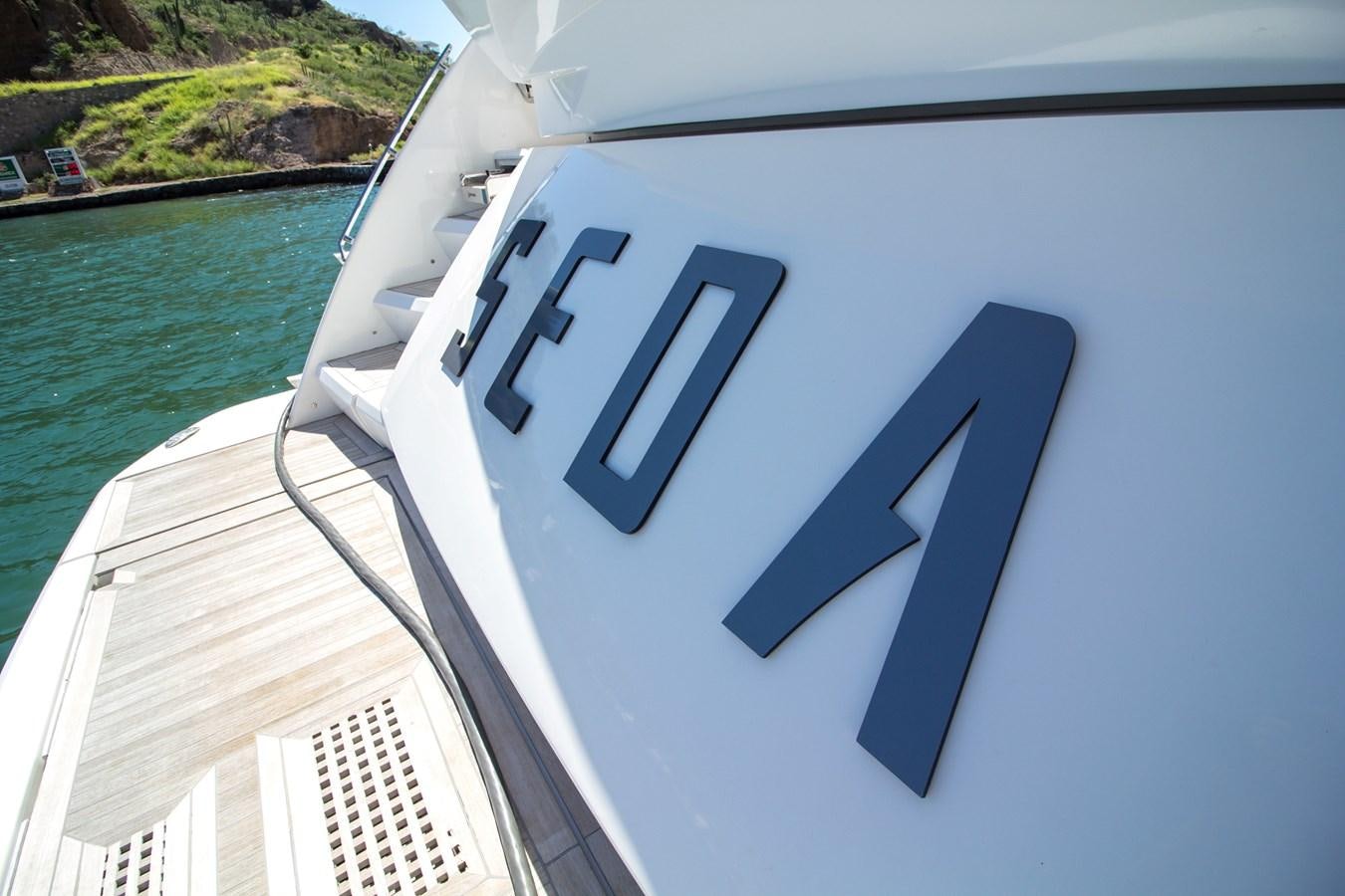 a white boat with a logo aboard SEDA Yacht for Sale