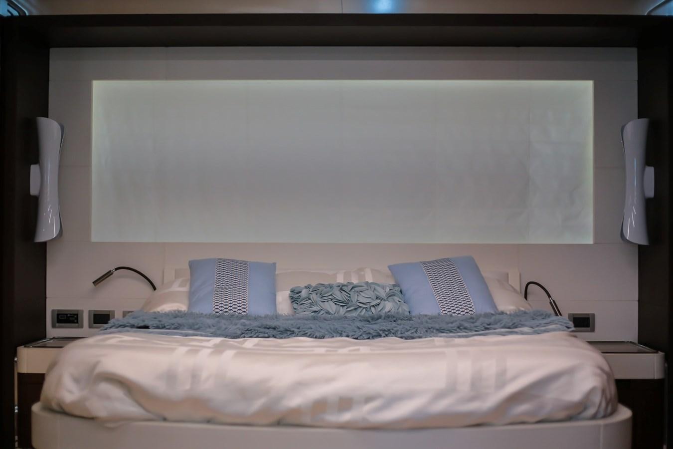a bed with a whiteboard on the wall aboard SEDA Yacht for Sale