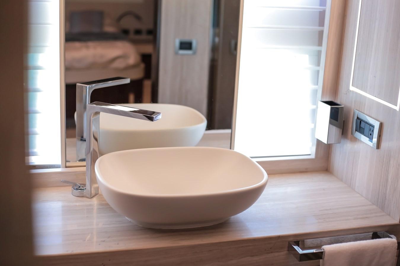 a white bowl on a counter aboard SEDA Yacht for Sale