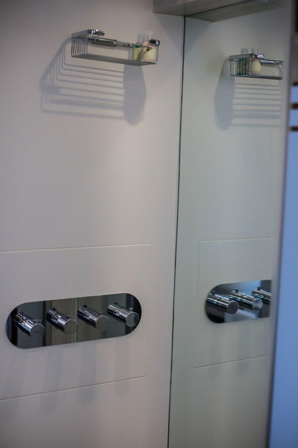 a shower with a couple of soap dispensers aboard SEDA Yacht for Sale