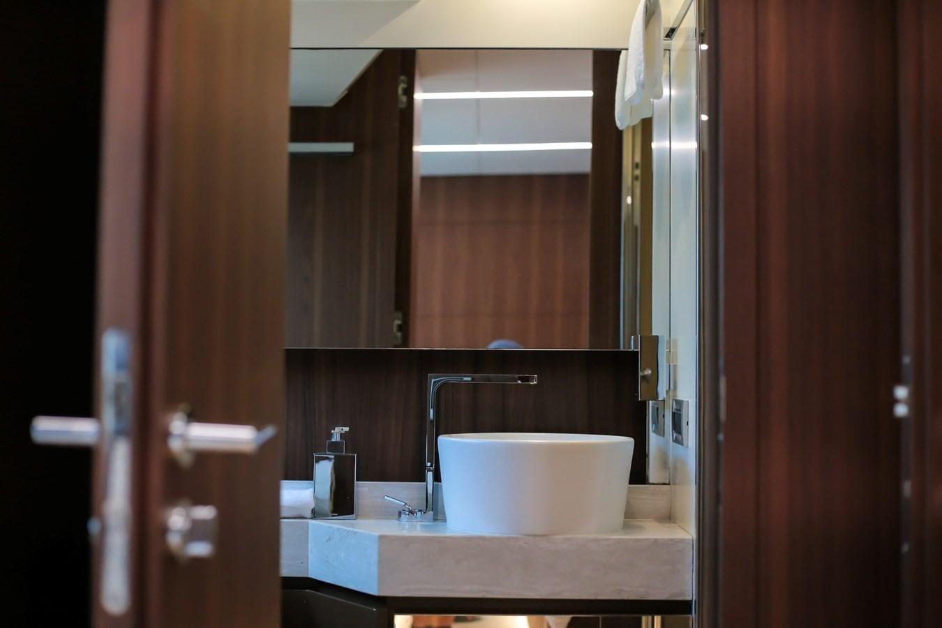 a bathroom with a sink and a mirror aboard SEDA Yacht for Sale