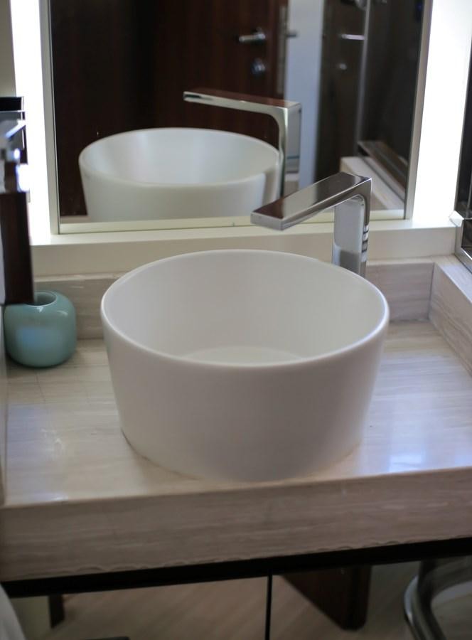 a white bowl on a wooden table aboard SEDA Yacht for Sale